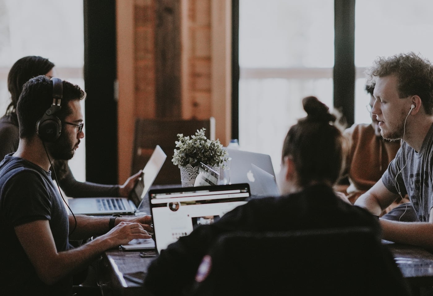 Professional team reviewing visa documentation in a modern office